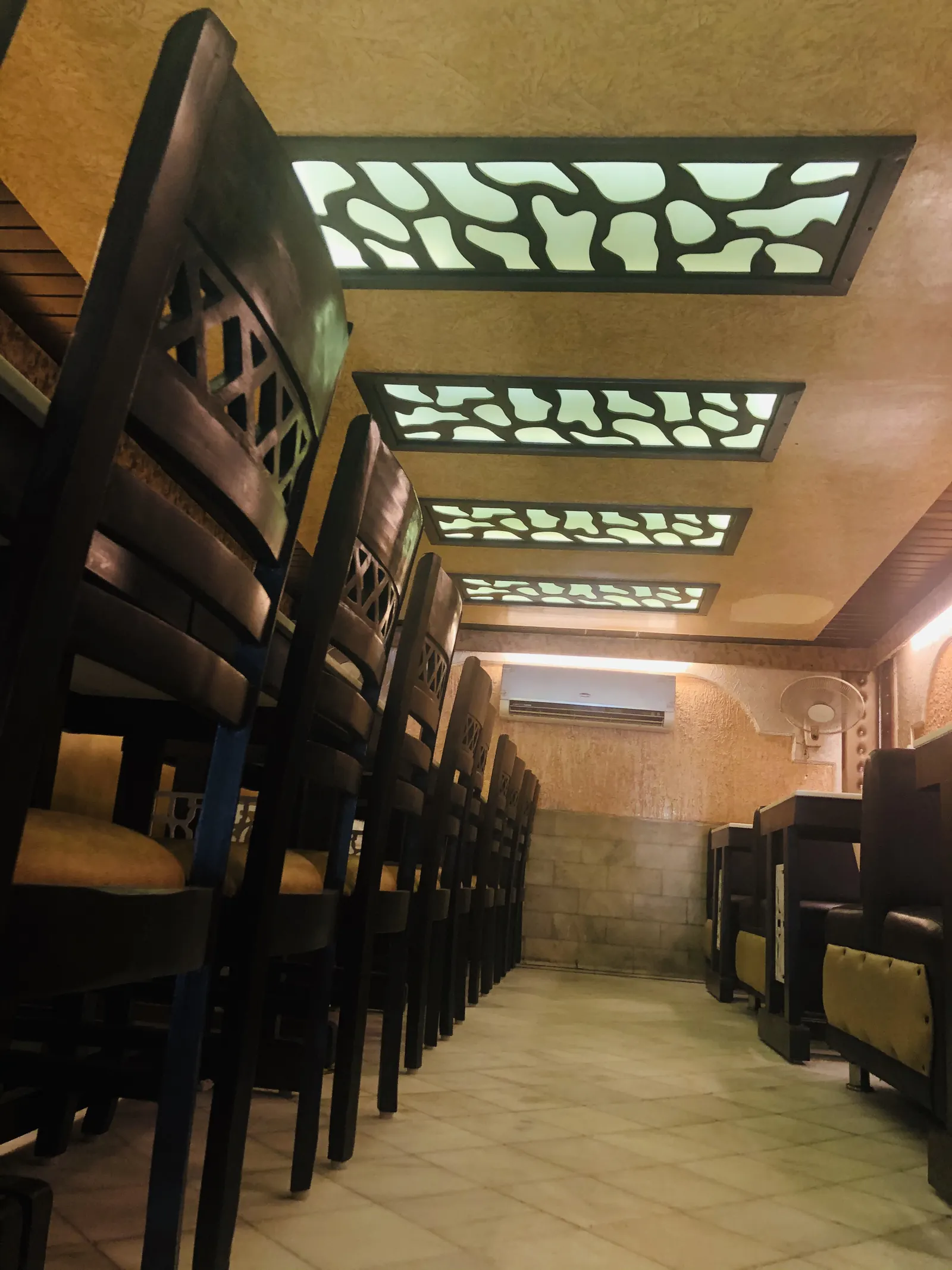 Seating along the side wall with carved ceiling panels