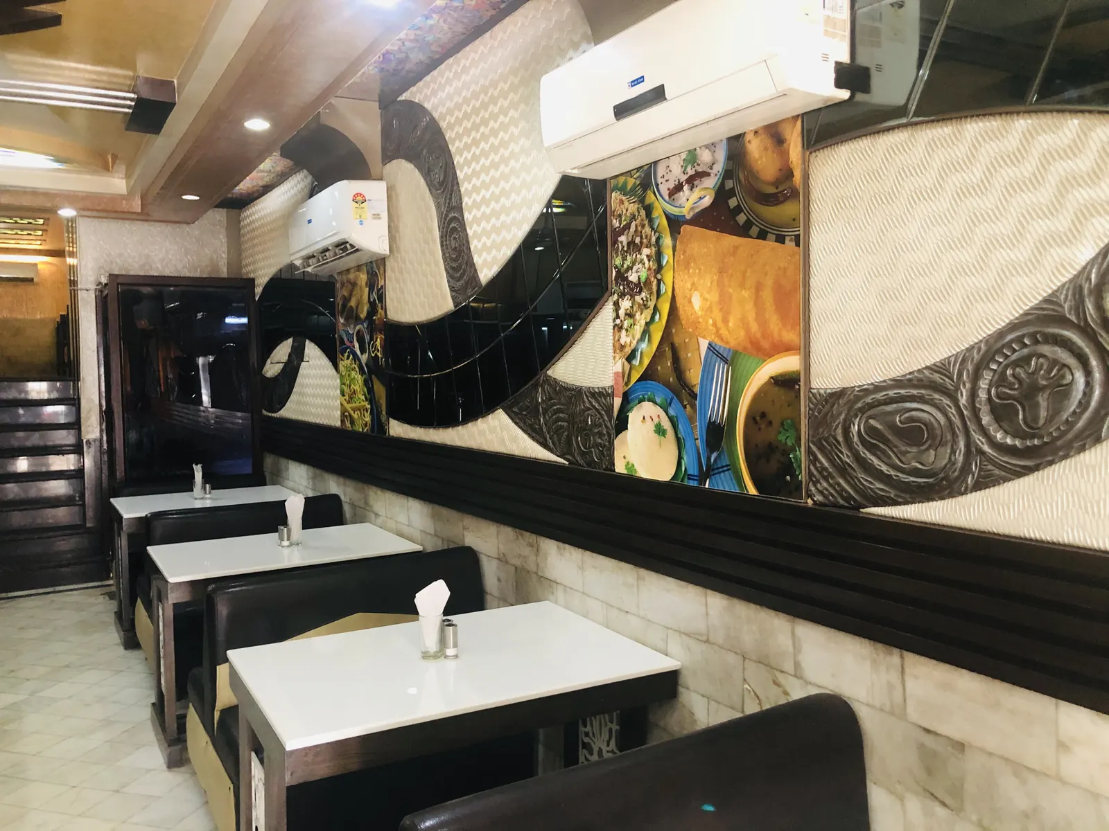 Mural wall and booth seating inside Chotiwala