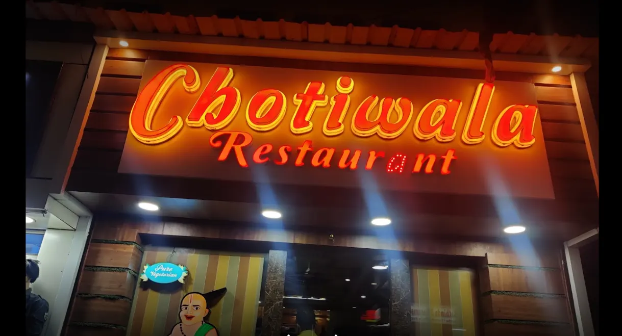 Chotiwala signboard lit up at night
