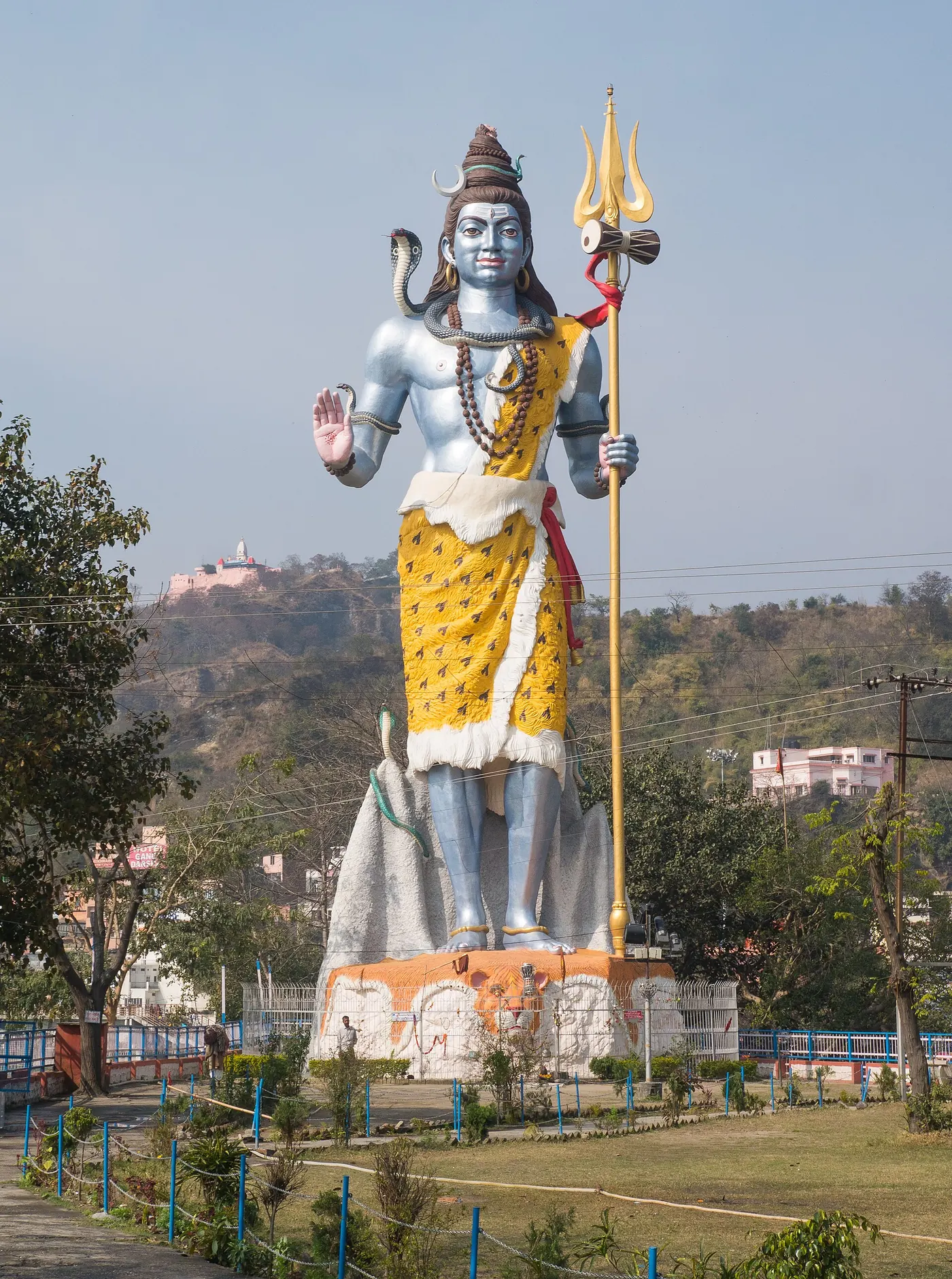 Lord Shiva stands tall over Haridwar, trident in hand.